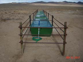 Completed water troughs with concrete base & protection fencing