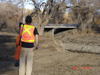 NHC Engineer Surveying by Pasture Road Bridge